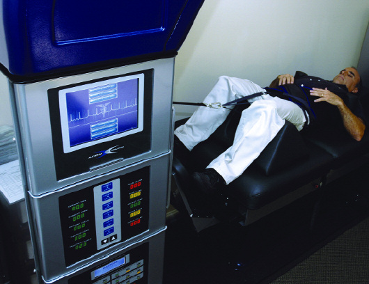 A volunteer lying on the DRX9000 table with the harness attached